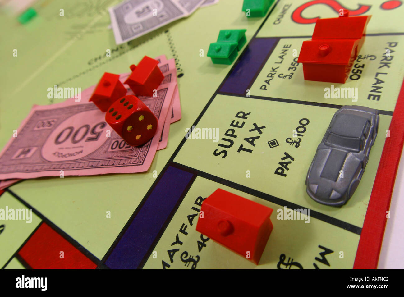 Monopoly board game houses London money Stock Photo Alamy