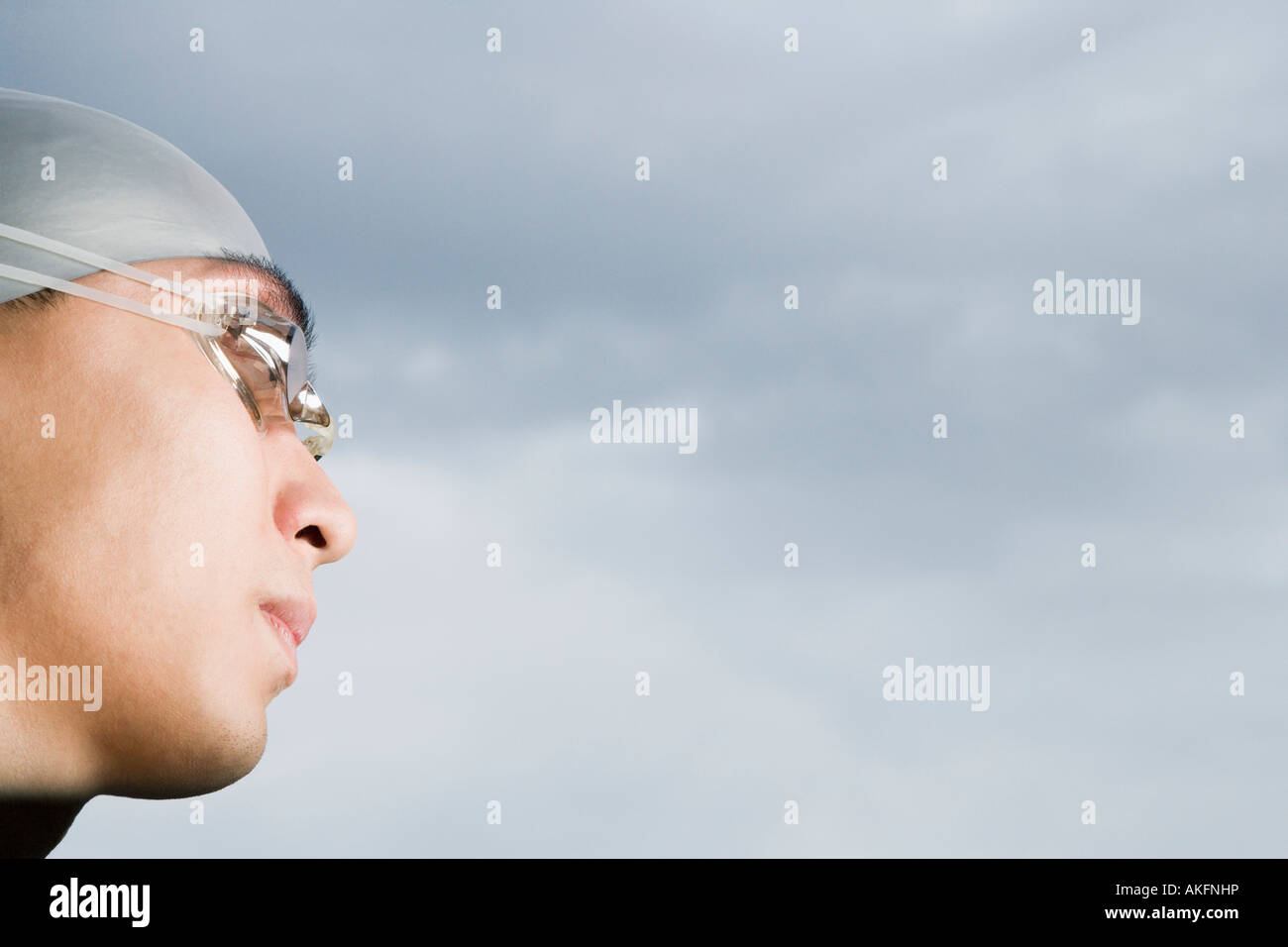 Close-up of a young man wearing swimming goggles Stock Photo