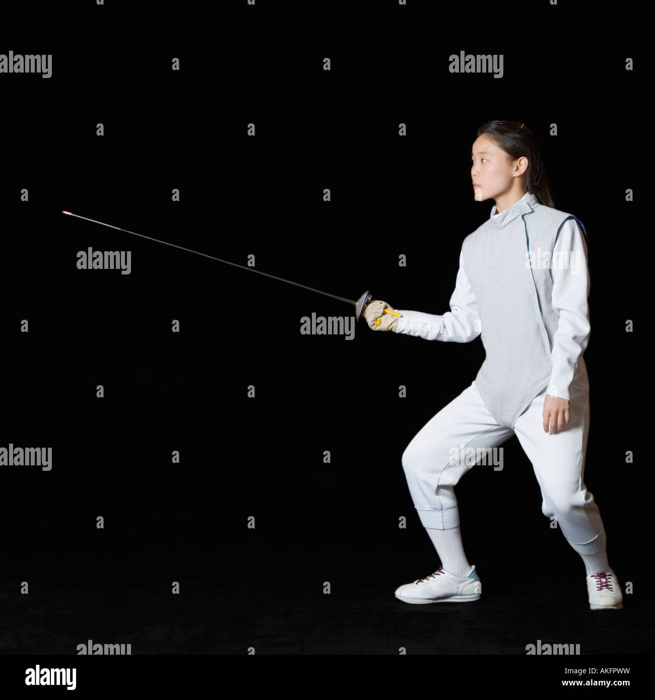 Female fencer holding a fencing foil Stock Photo Alamy