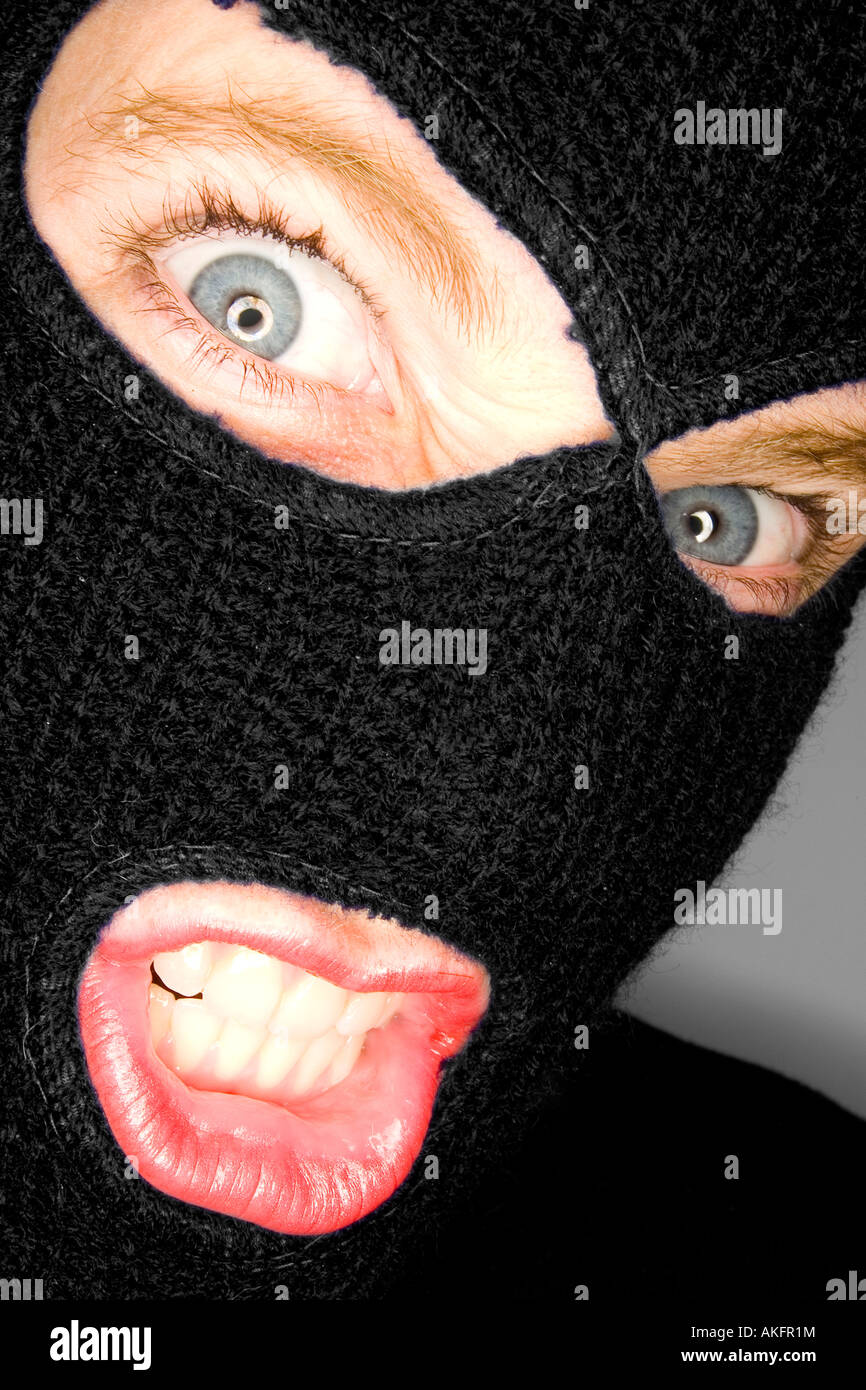 A stock photograph of an attractive woman wearing a balaclava Stock