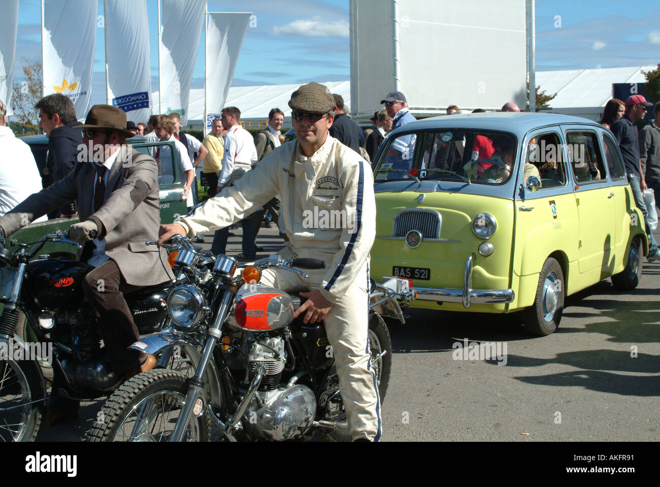Old Triumph Motorbikes and Fiat Taxi at Goodwood Revival Meeting 2005 Stock Photo