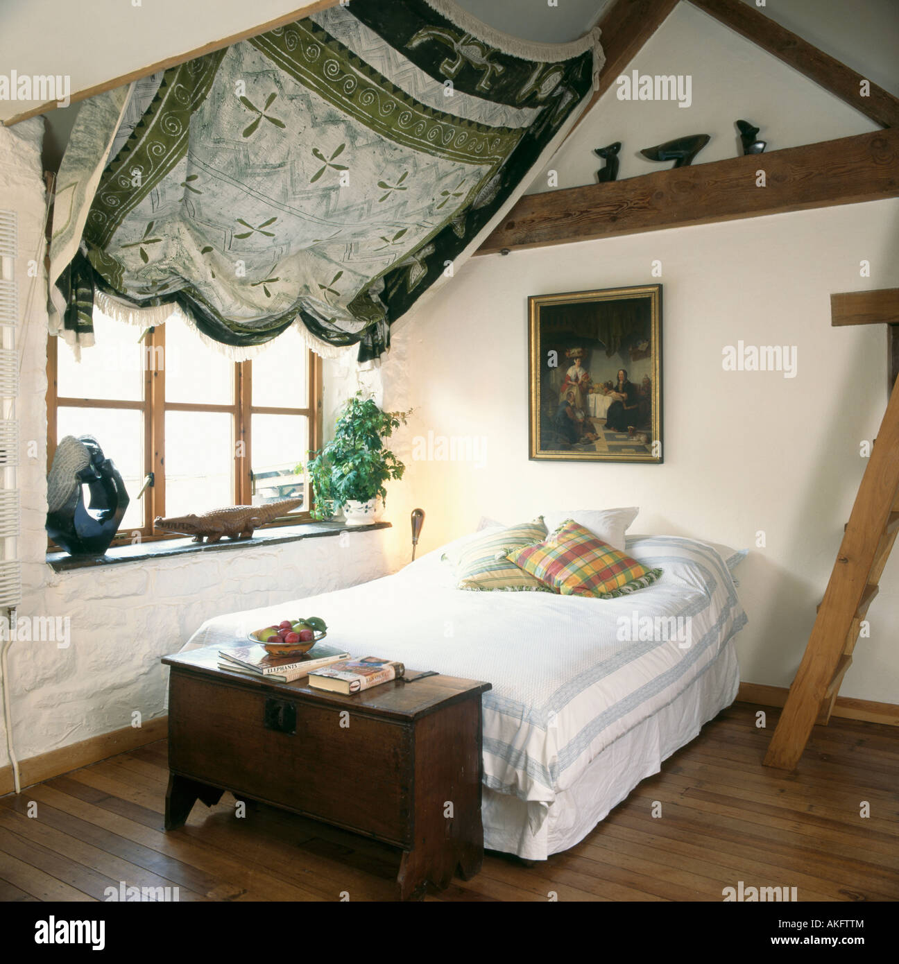 Antique Chest At The End Of The Bed In Attic Country Bedroom