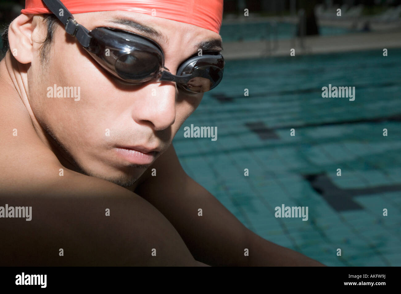 Portrait of a young man wearing swimming goggles Stock Photo