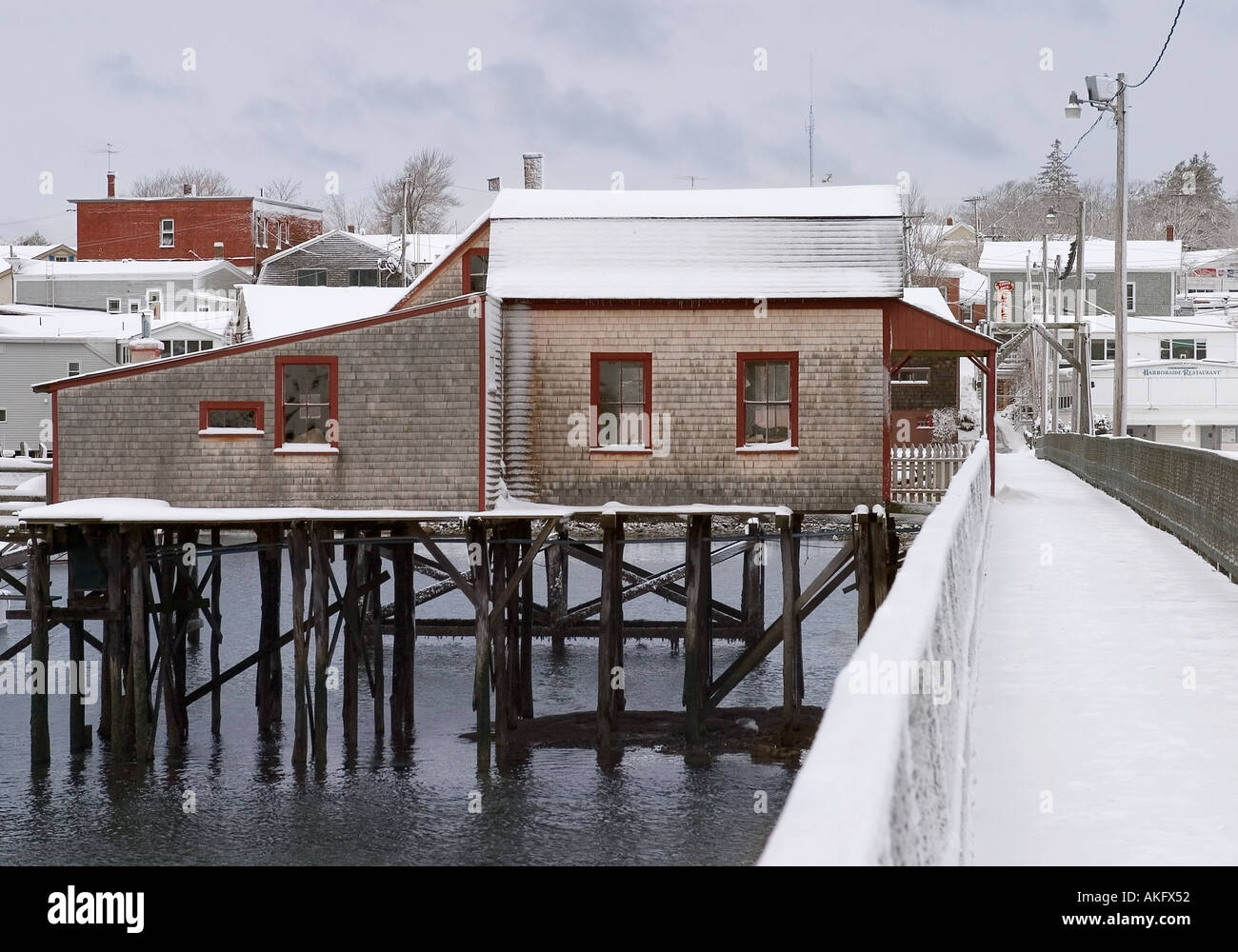Fishing shack and pier, Boothbay Harbor, Maine after a snowfall Stock Photo