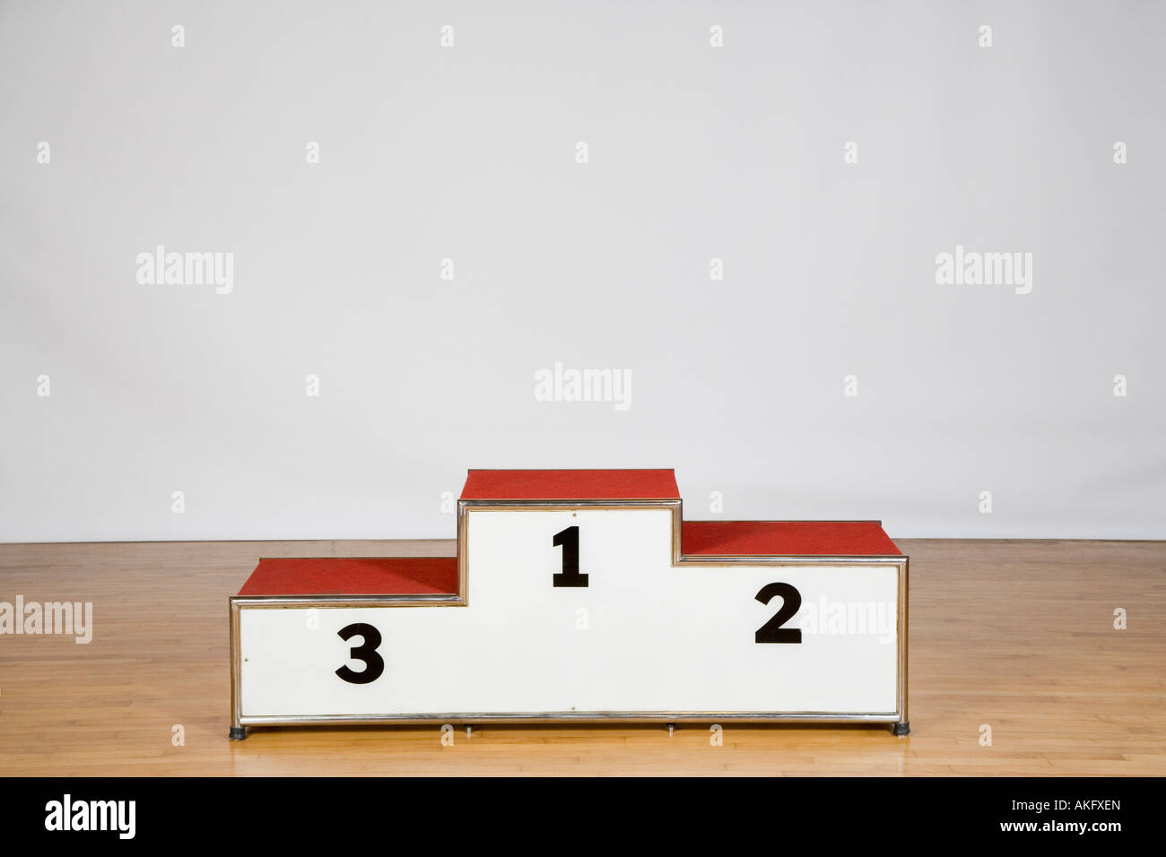 Winners podium on a wood laminate flooring Stock Photo