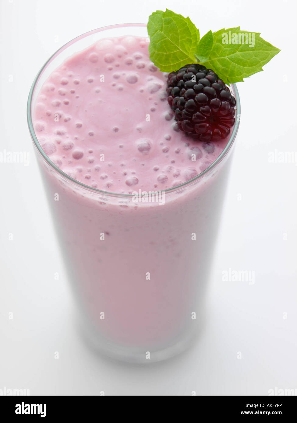 blackberry fruit smoothie healthy editorial food in a tall glass topped