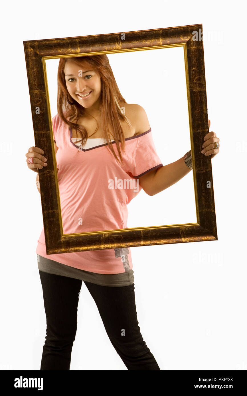 Woman posing with picture frame Stock Photo