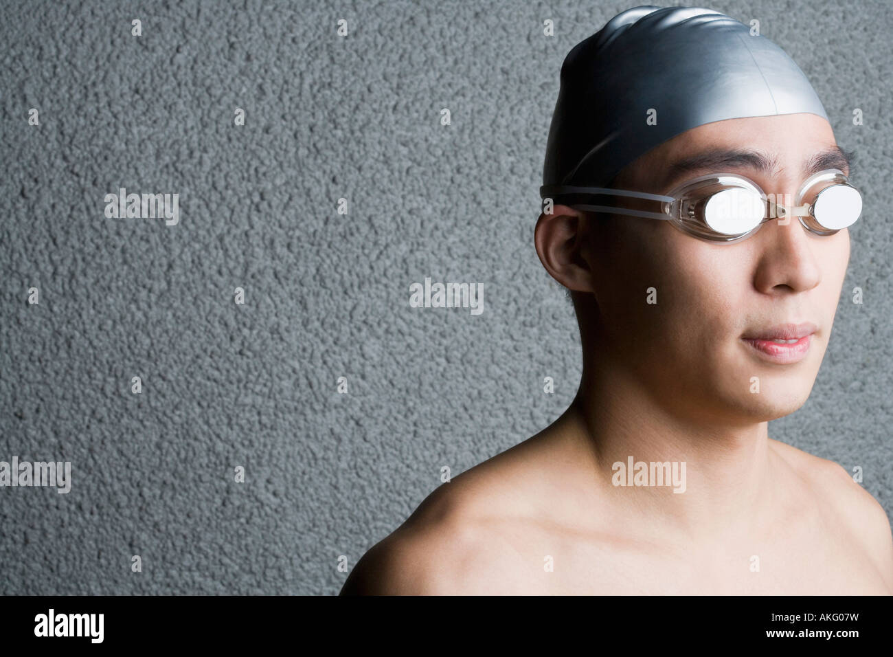 Close-up of a young man wearing swimming goggles Stock Photo