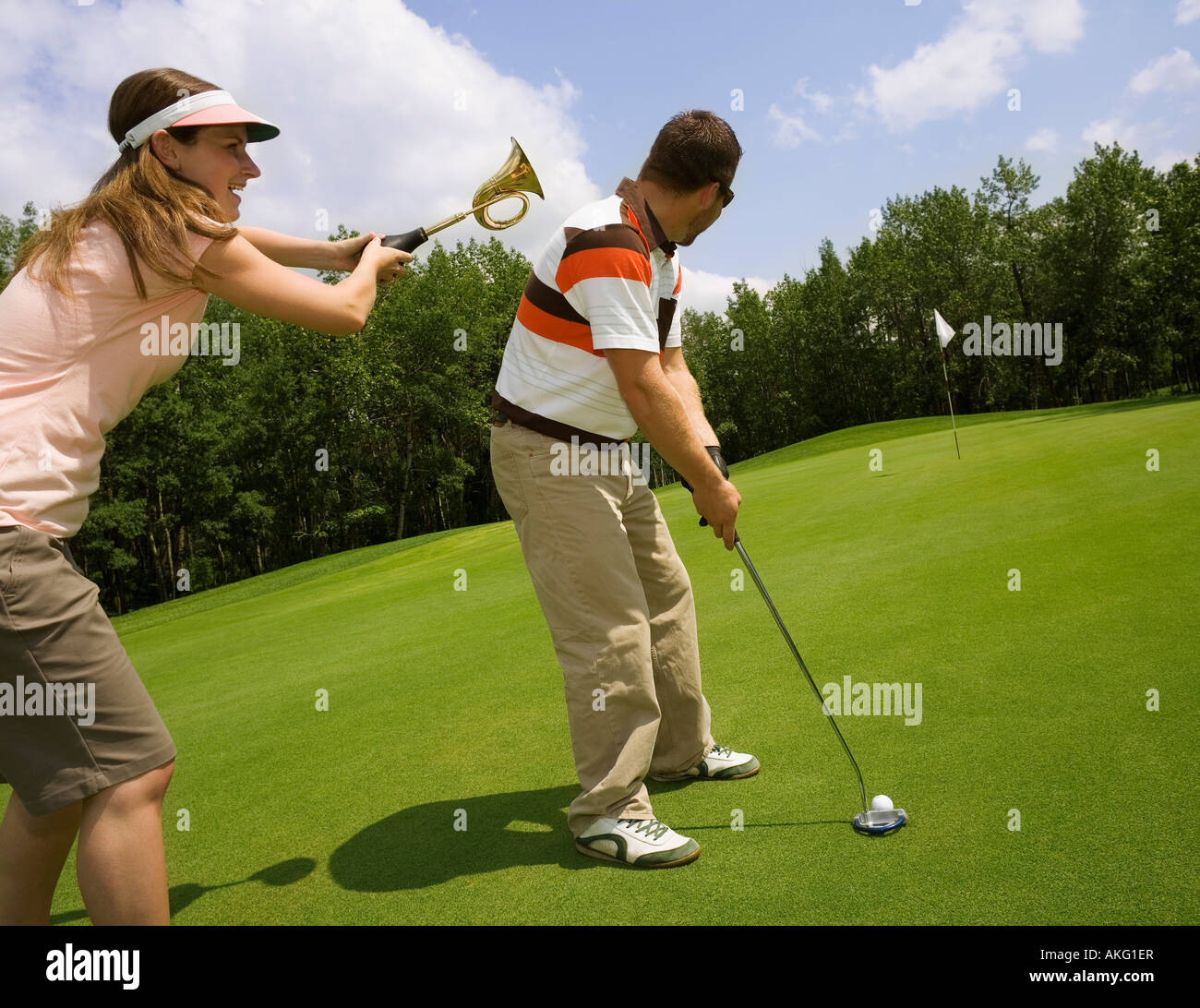 A couple playing golf Stock Photo