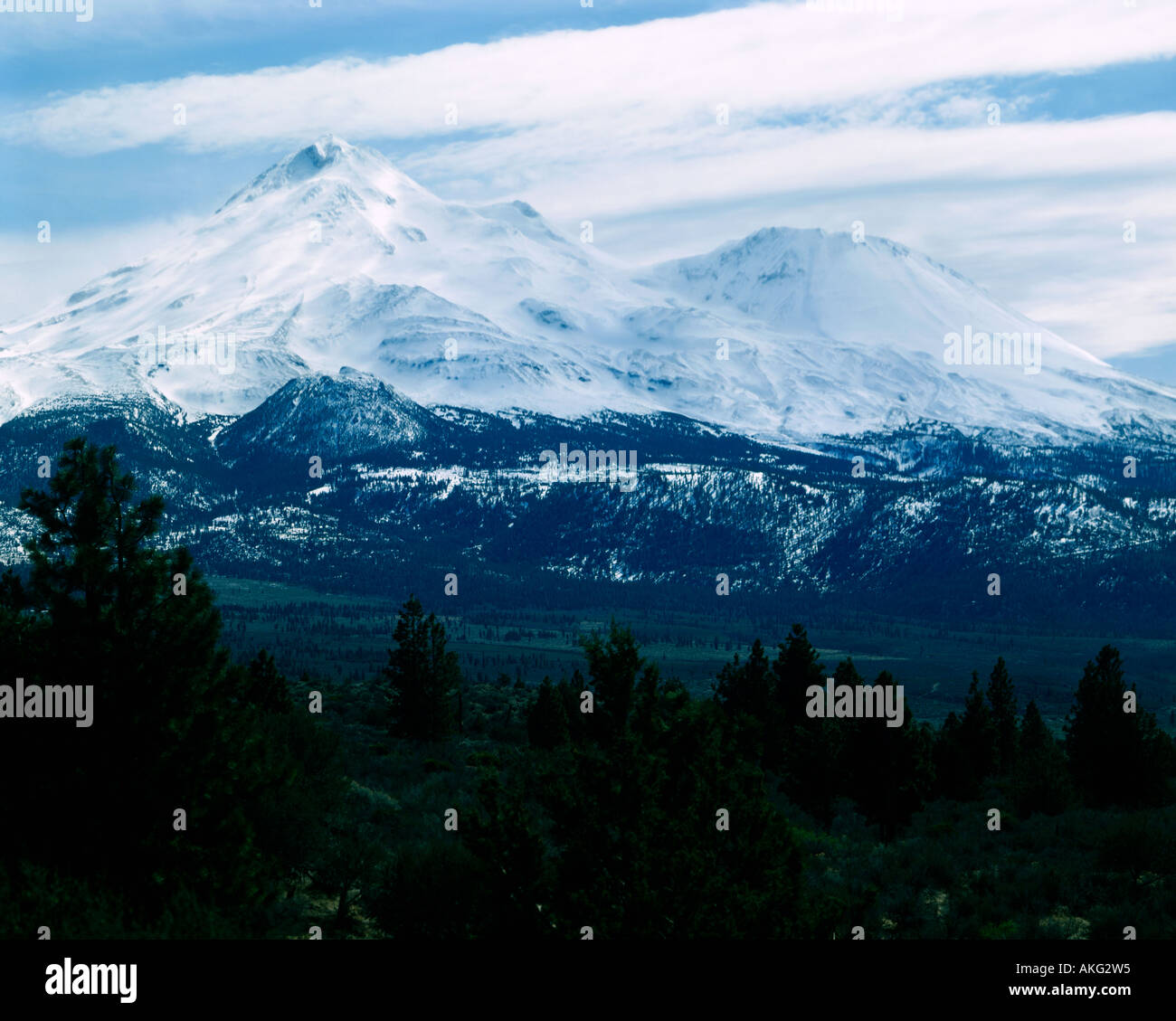 Distant Mount Shasta dominates the skyline in Northen California Stock Photo