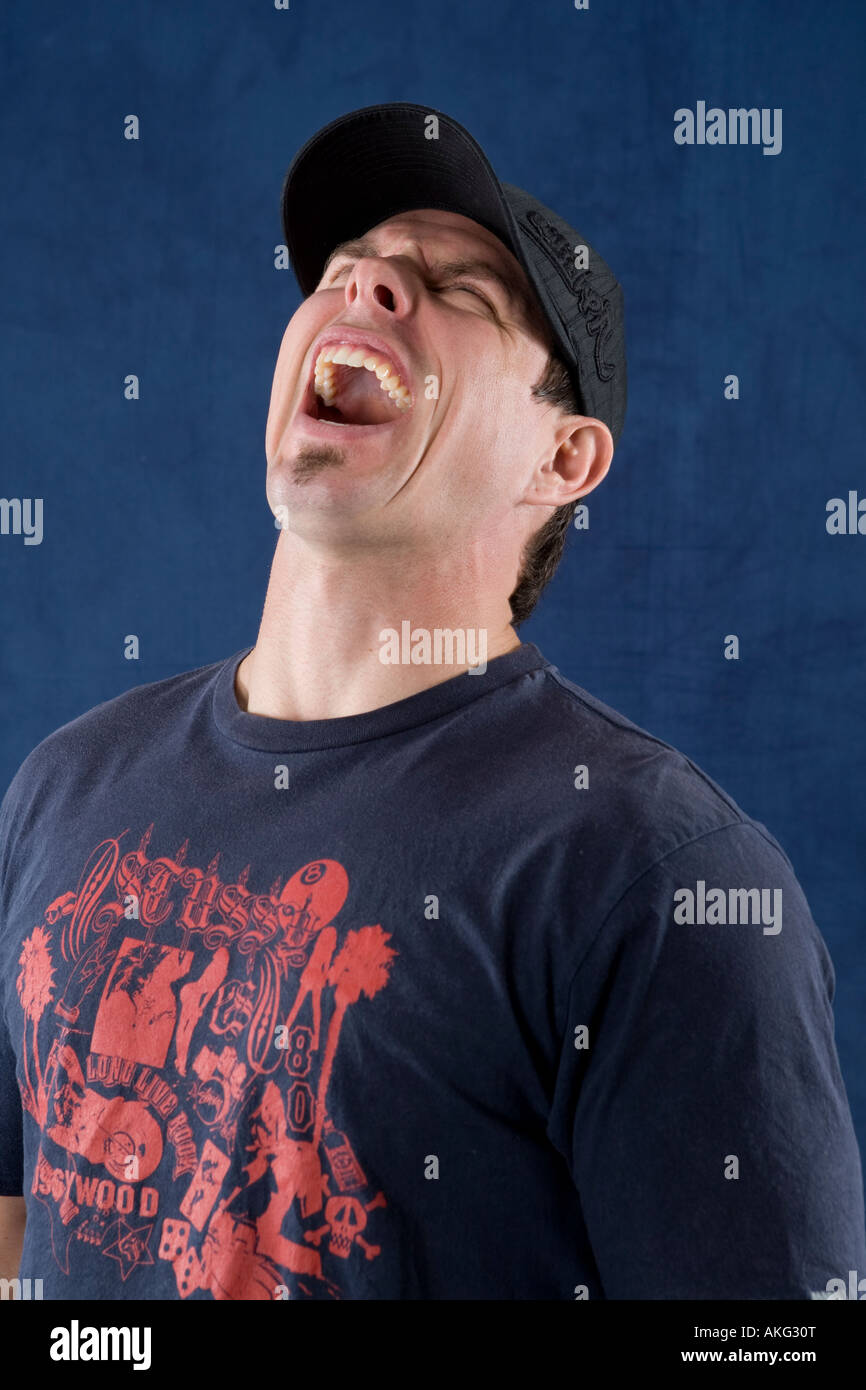 close up of a hot fit male with no shirt on wearing a baseball hat backwards Stock Photo Alamy