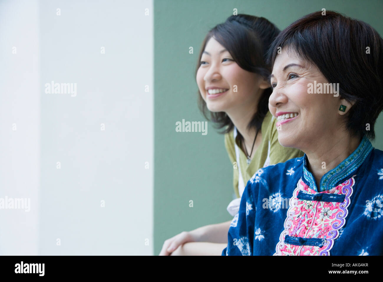 Close-up of a senior woman smiling with her granddaughter Stock Photo
