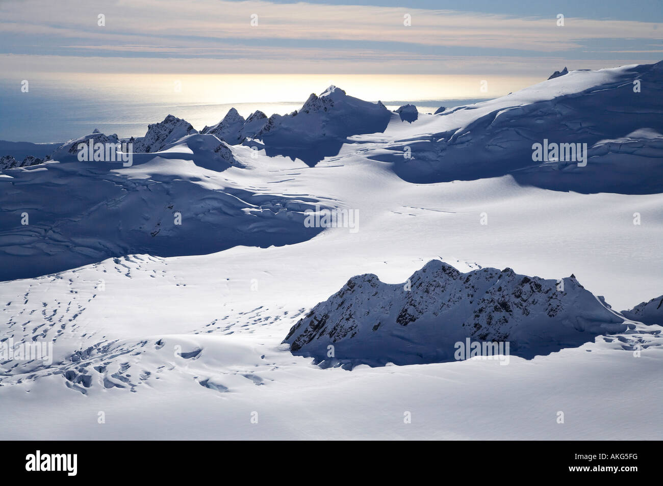 Chamberlin Snowfield and Mackay Rocks above Franz Josef Glacier West Coast South Island New Zealand aerial Stock Photo