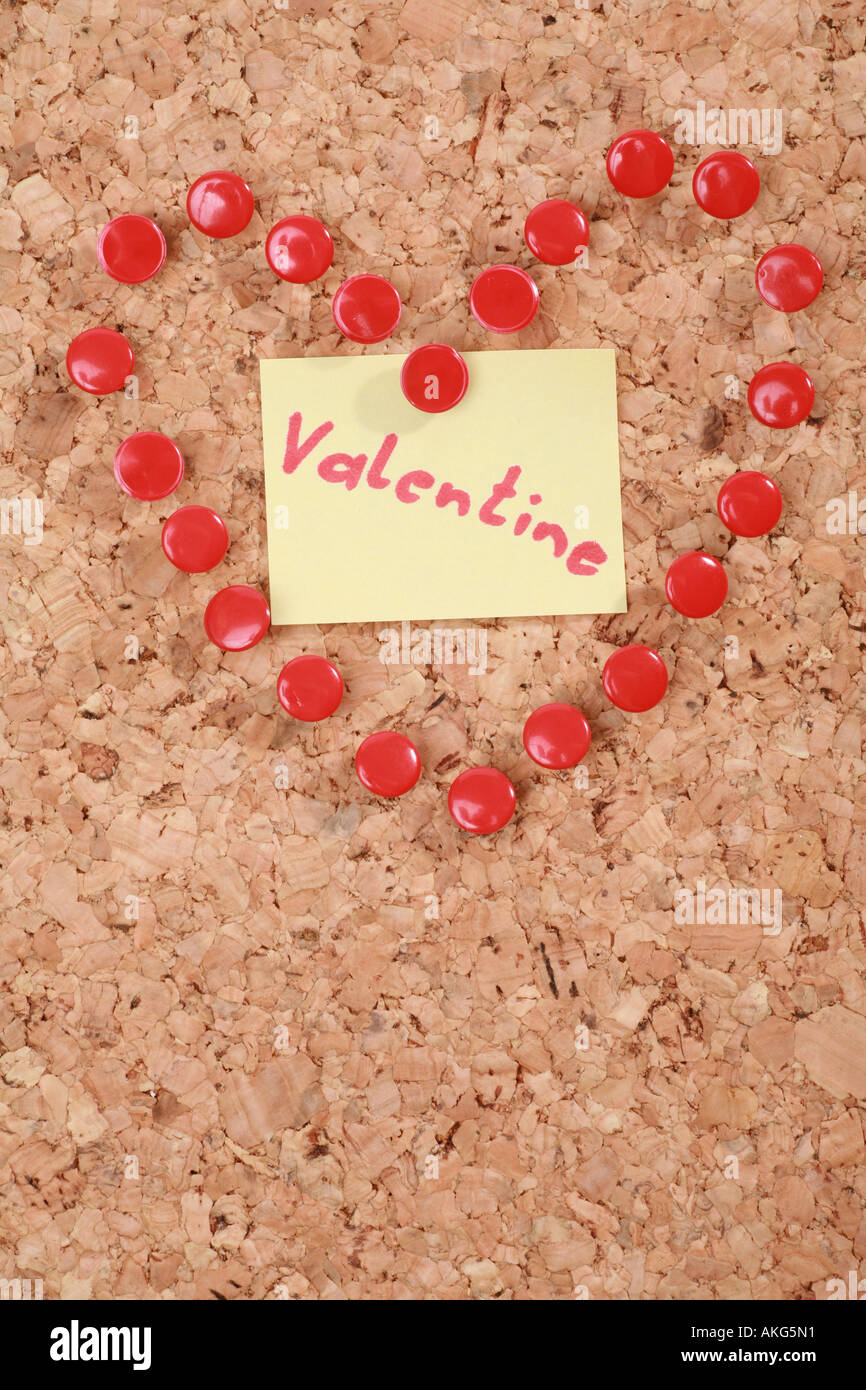 a valentine heart made of thumb tacks on a corkboard Stock Photo