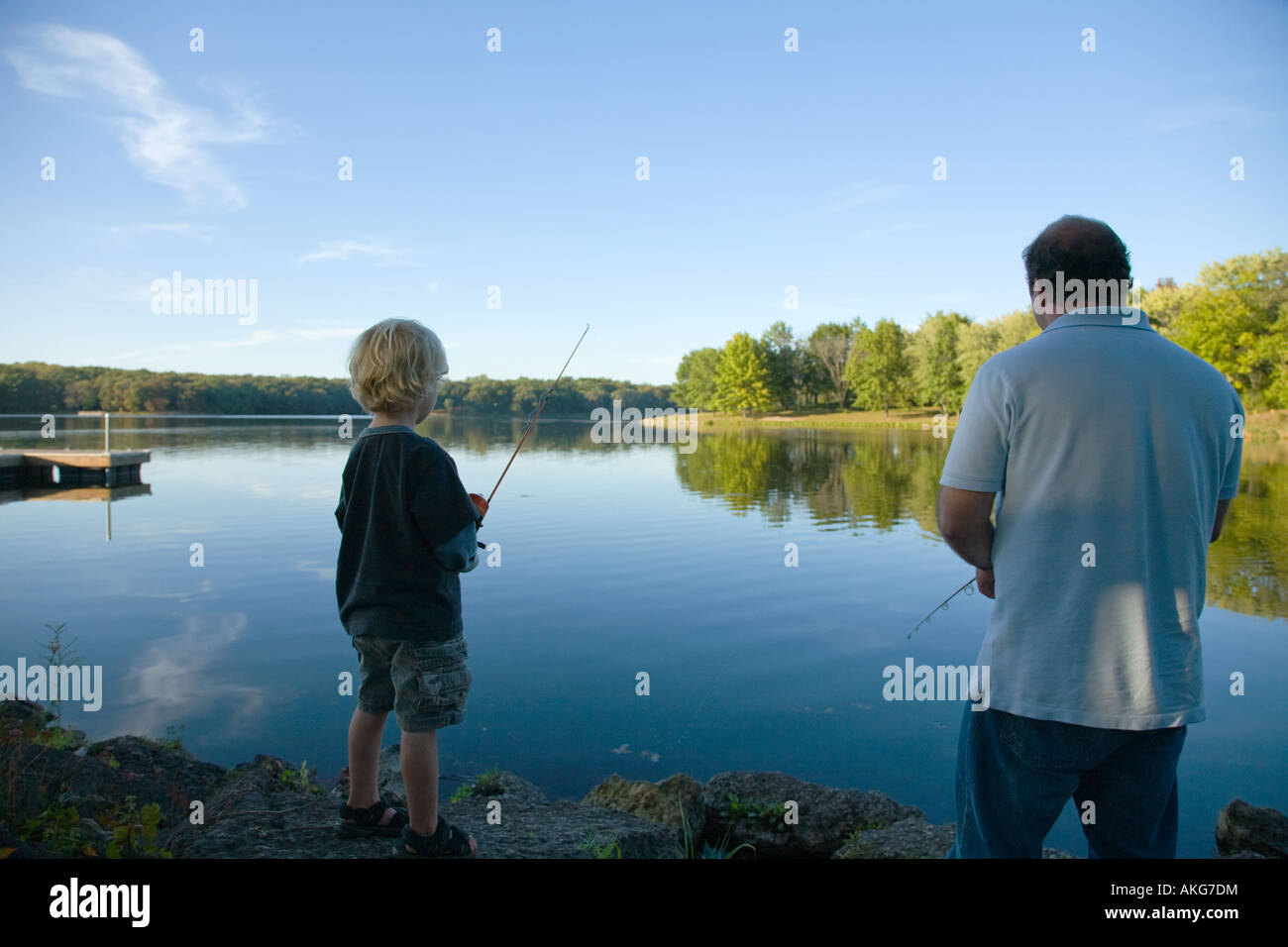 ILLINOIS Rockford Father and boy fishing in lake Rock Cut State Park