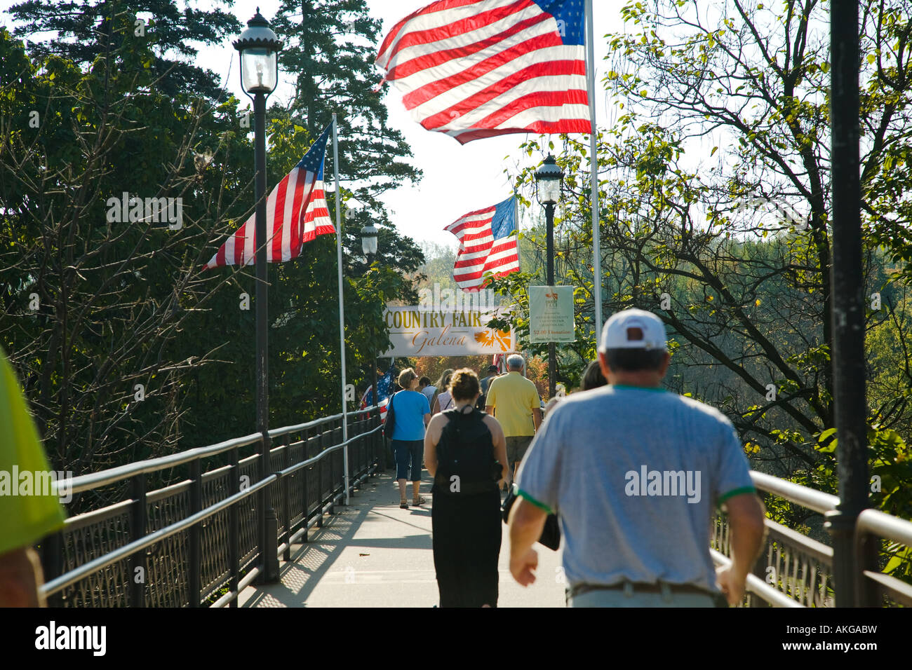 ILLINOIS Galena People walk across bridge to Country Fair annual