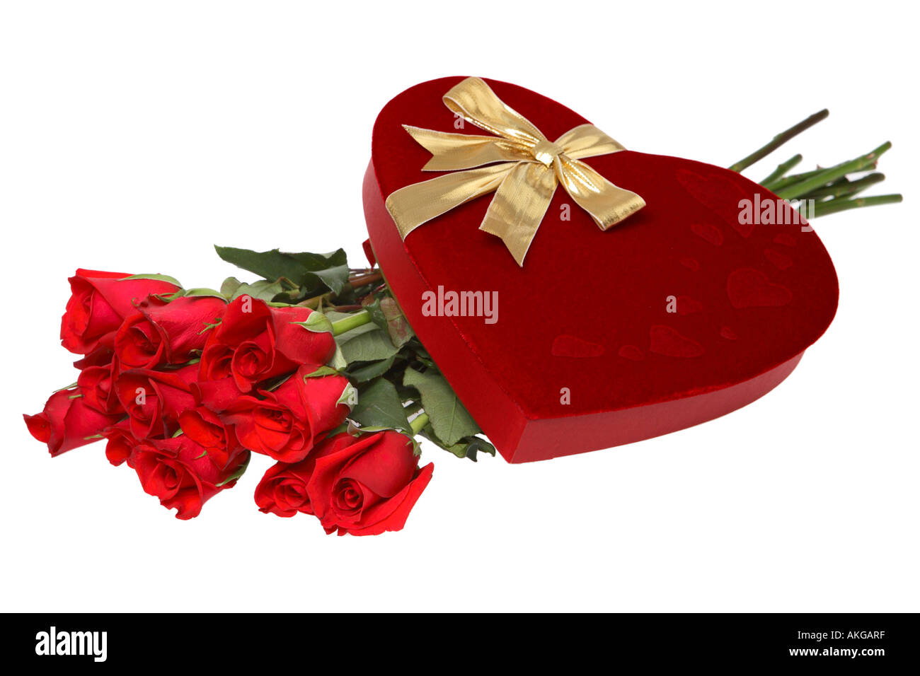 Box of Valentines Day Chocolates and a Dozen Long Stem Roses Stock Photo
