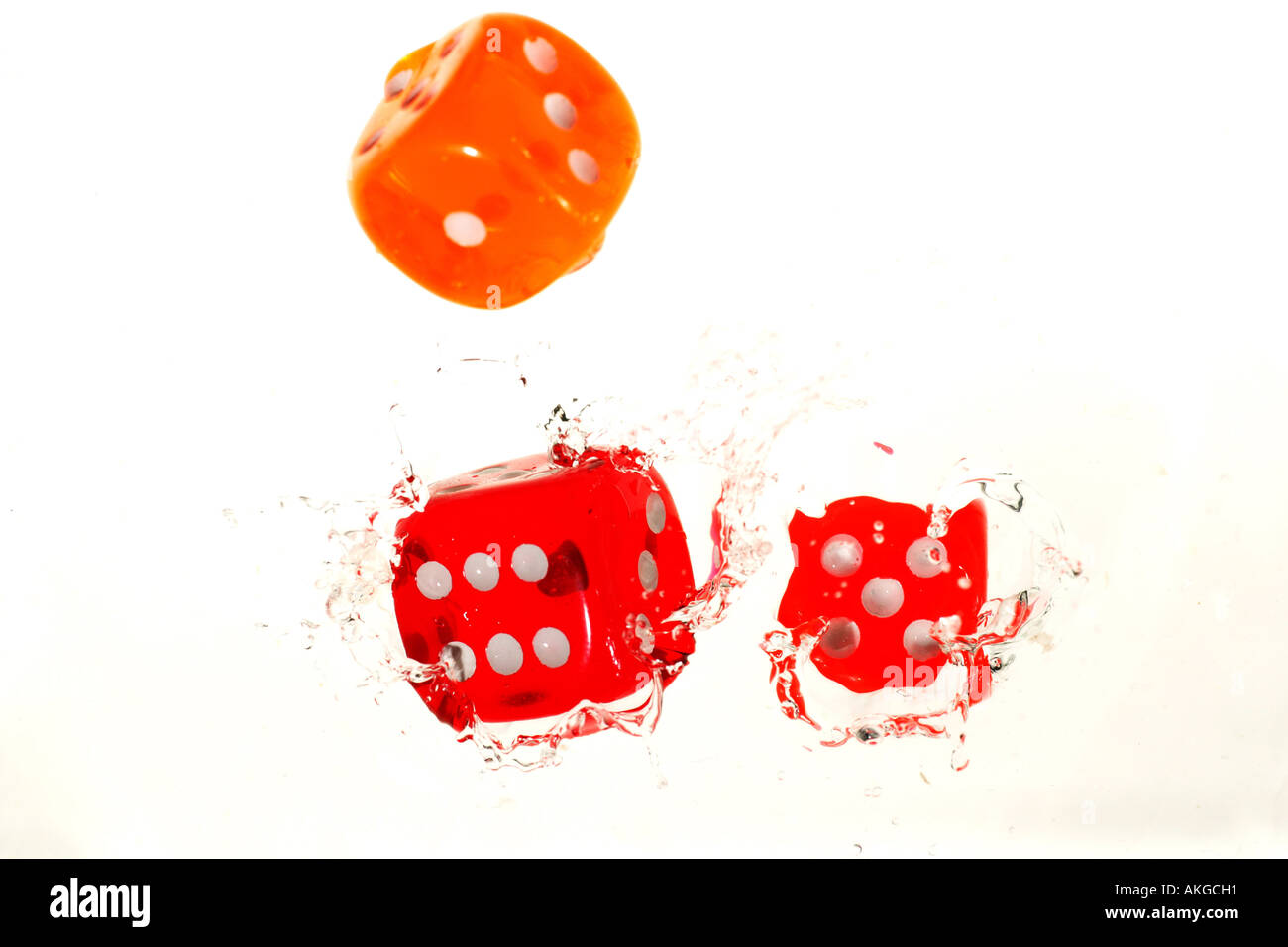 colorful dices falling in water Stock Photo