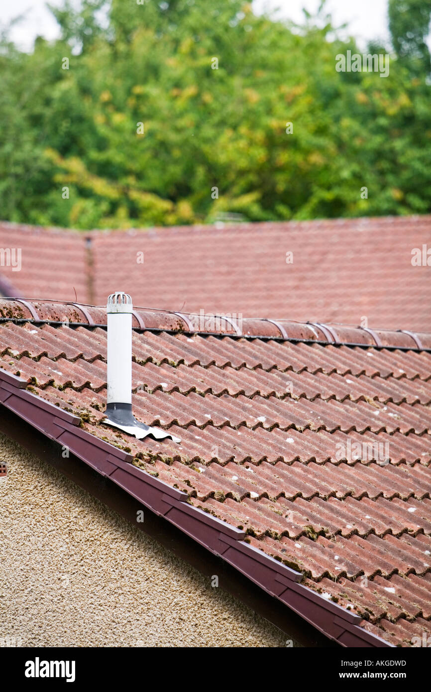 Heating air vent chimney on roof of house Stock Photo Alamy