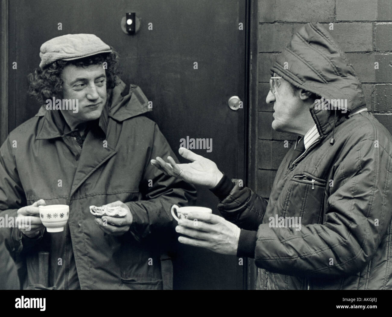 Candid couple chatting, Manchester, UK. Black and white photo, 1970s. Stock Photo