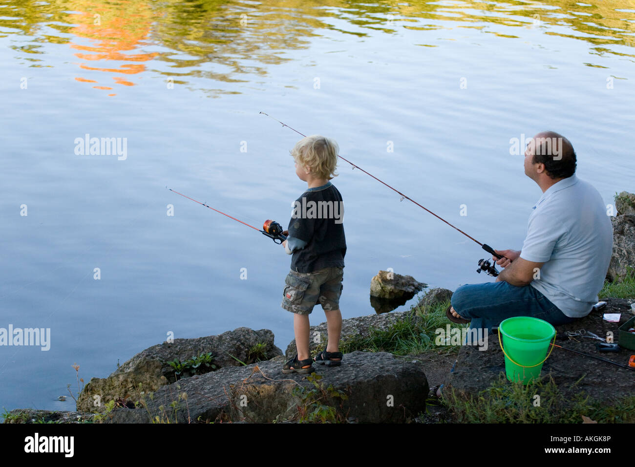 ILLINOIS Rockford Father and boy fishing in lake Rock Cut State Park