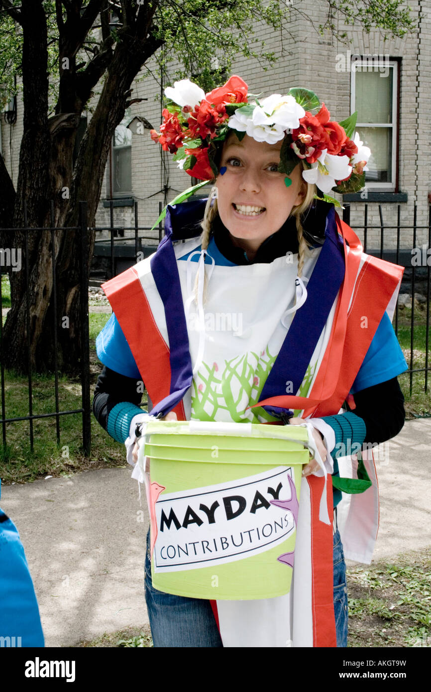 Money placed in bucket is support for the MayDay Parade and festivities. MayDay Parade and Festival. Minneapolis Minnesota USA Stock Photo