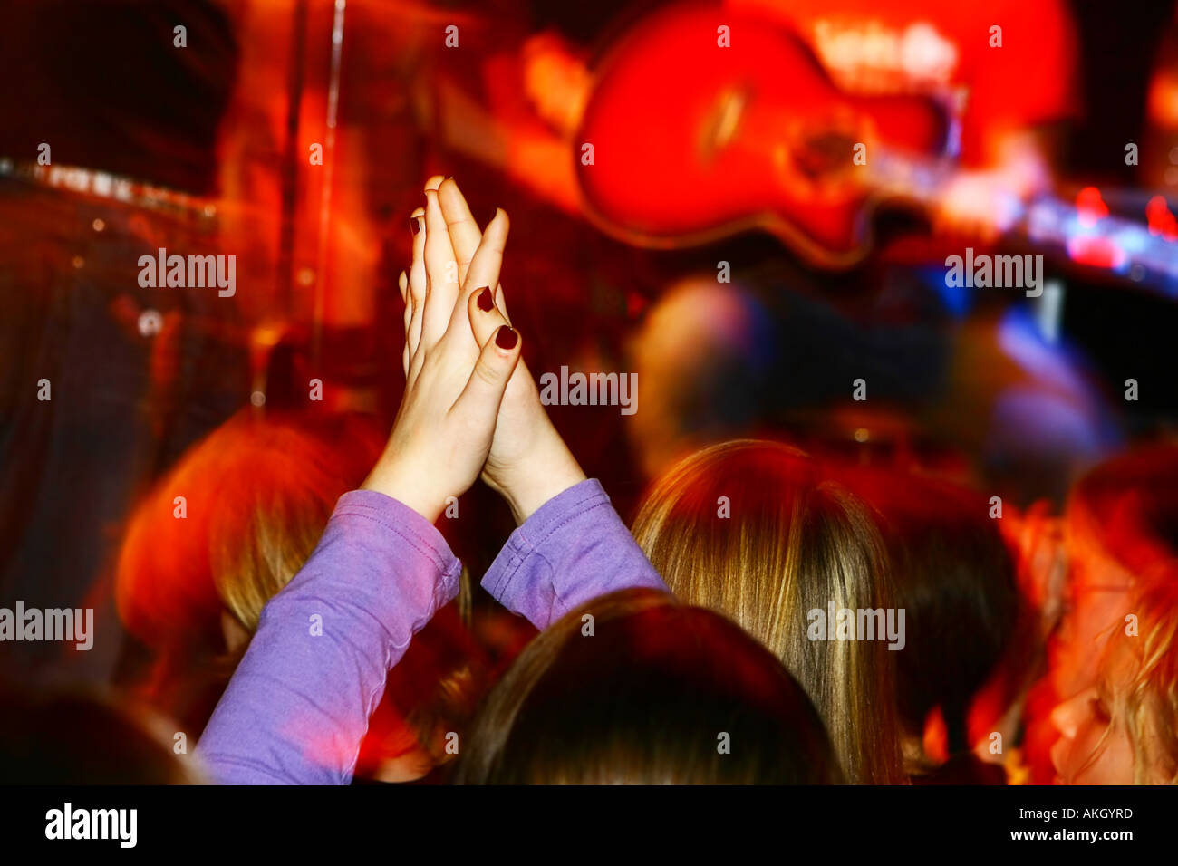 people at a concert applaude an Band motioneffect Stock Photo
