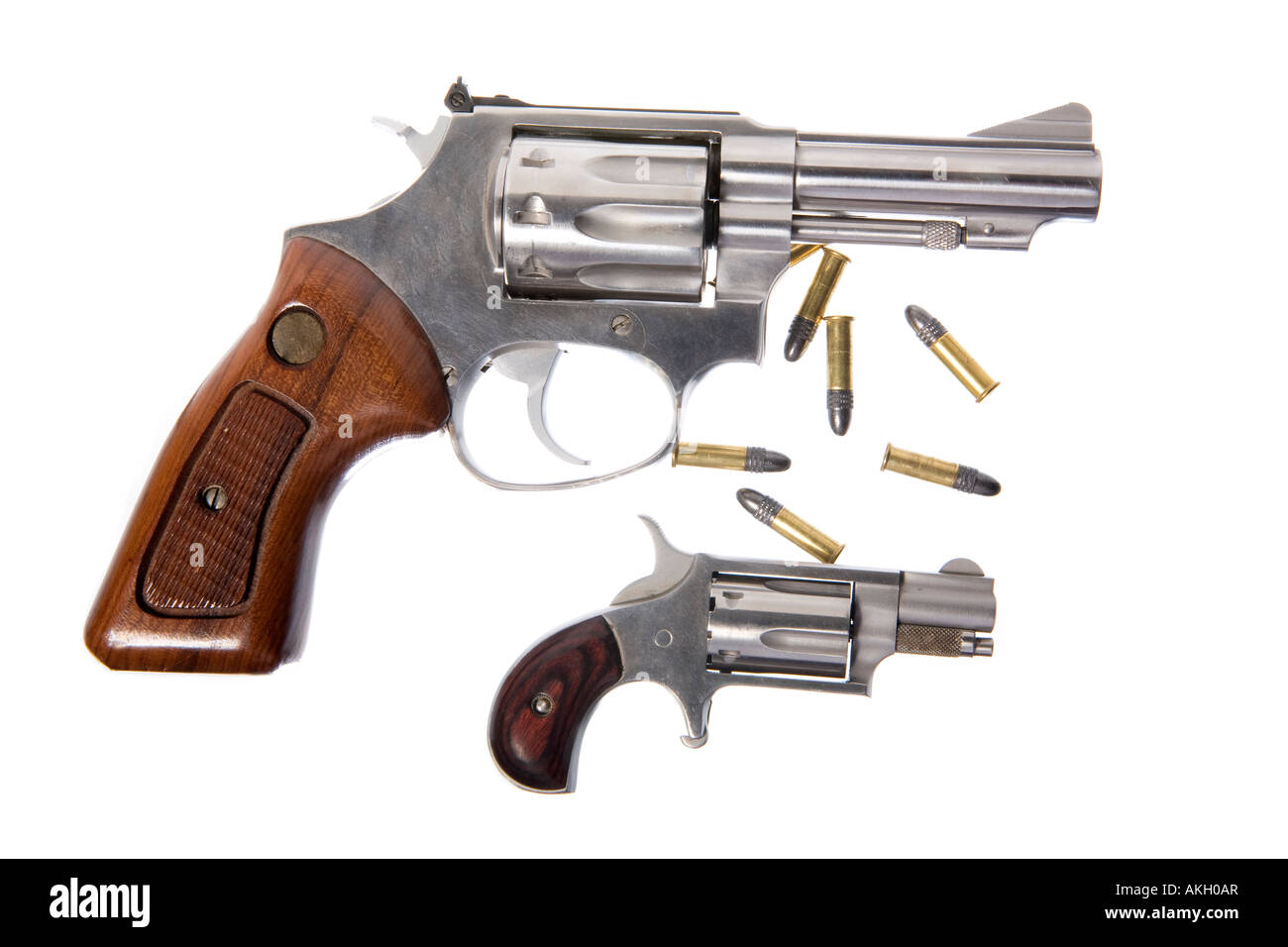 Big 22 caliber hand gun and small 22 caliber hand gun isolated on white background Stock Photo