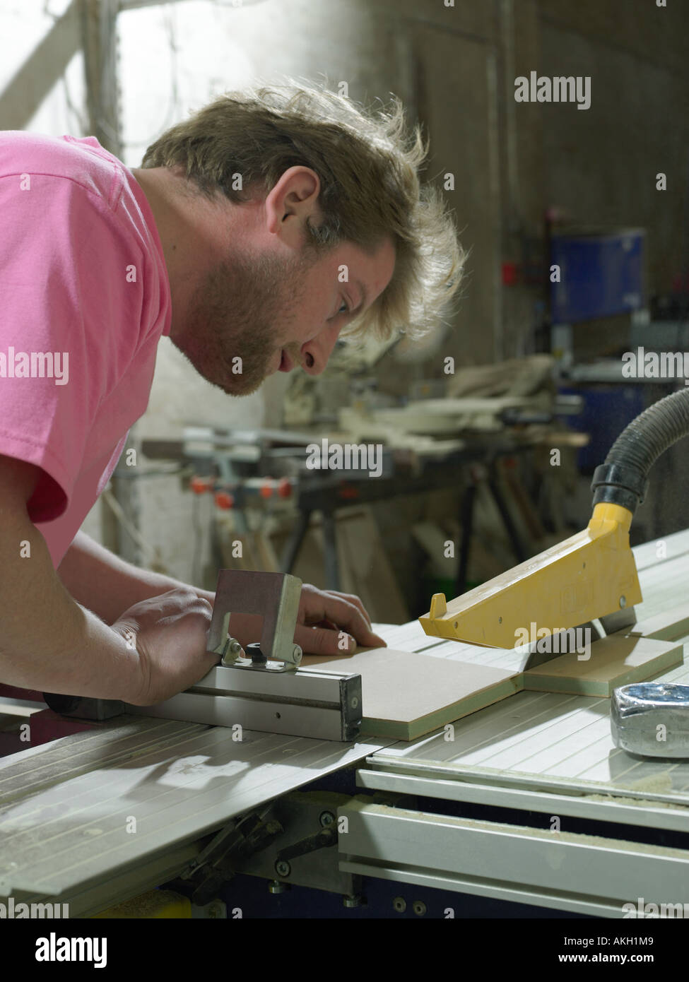 Carpenter using table saw Stock Photo Alamy