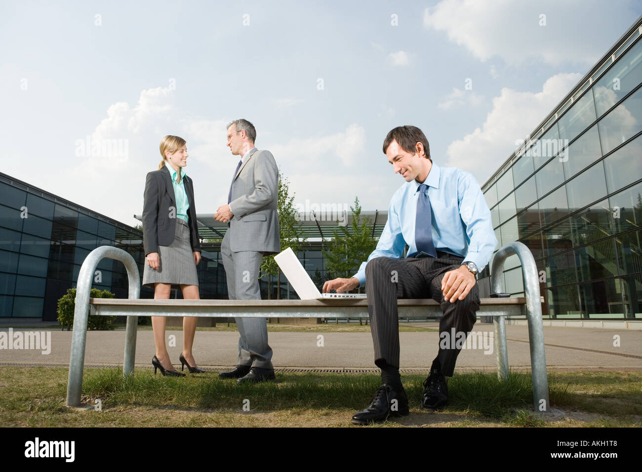 Businesspeople on office court bench Stock Photo