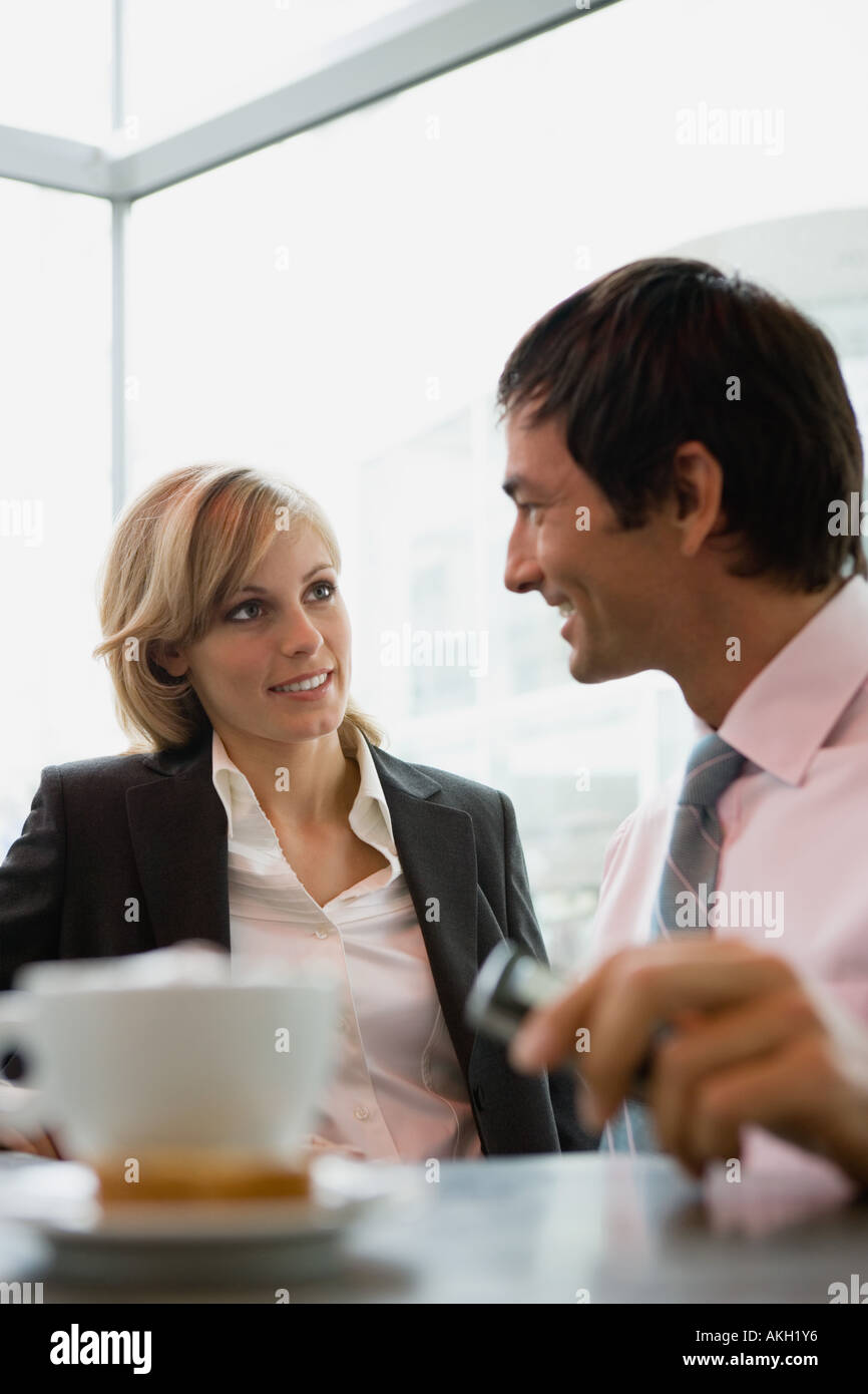 Businesswoman and businessman having coffee break Stock Photo