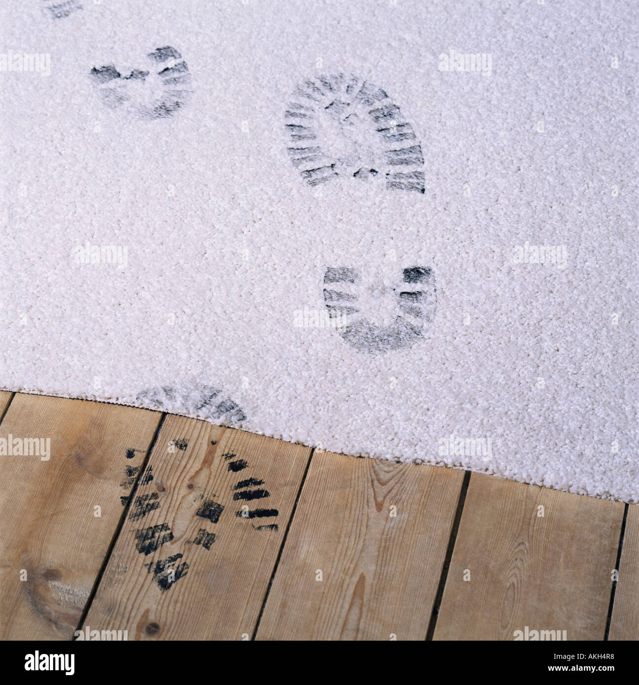 Black footprints on a carpet Stock Photo Alamy
