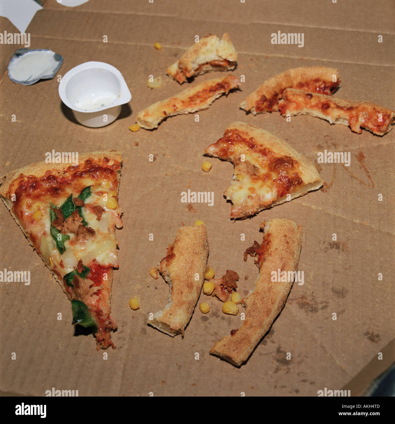 Pizza crusts left in a box Stock Photo
