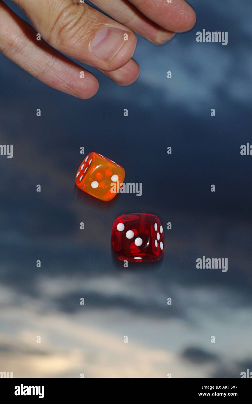 hand throwing dices Stock Photo