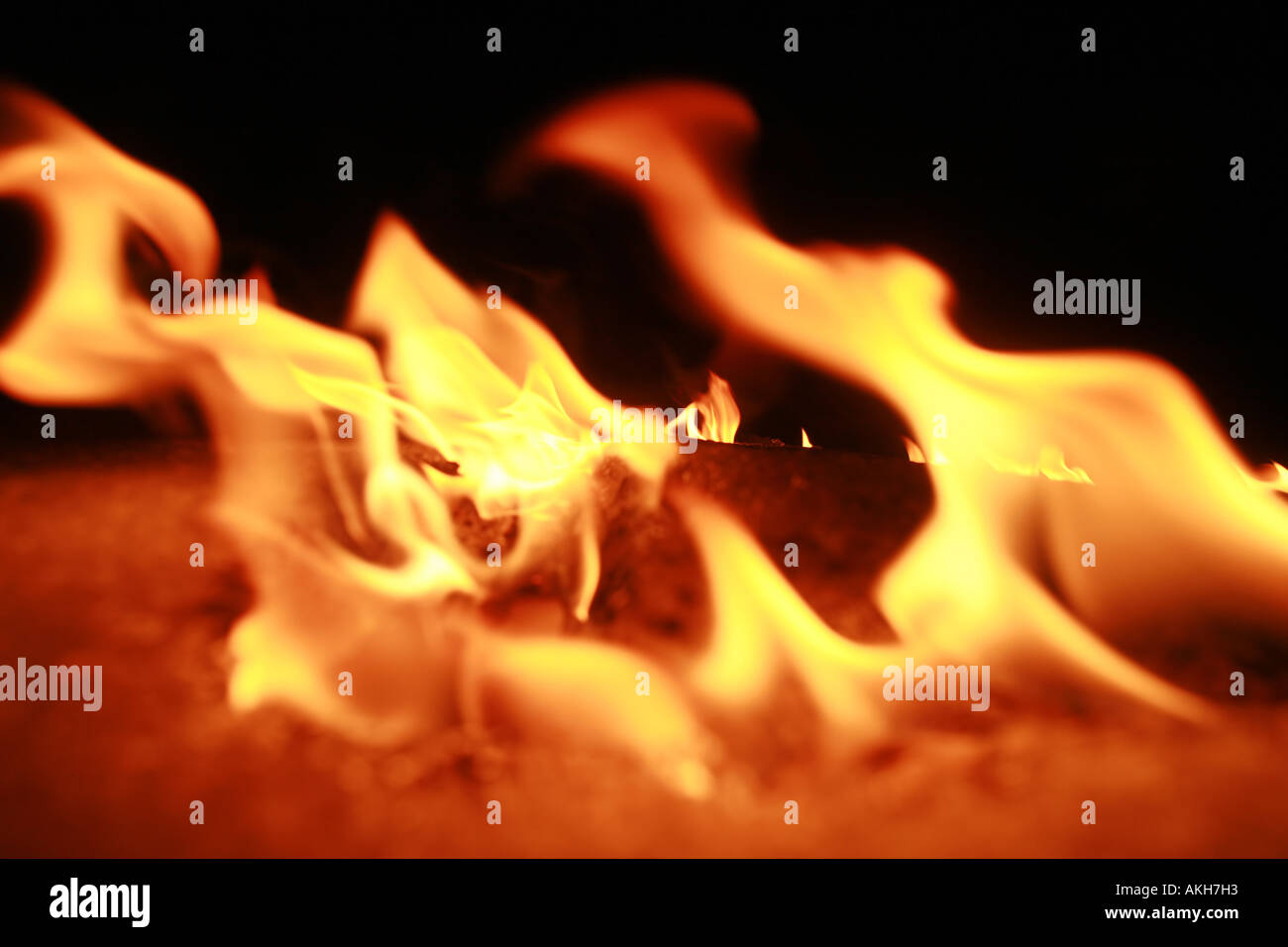 snow shallow DOF the Focus is on the last flame in the background the flames in the foreground are blurred Stock Photo