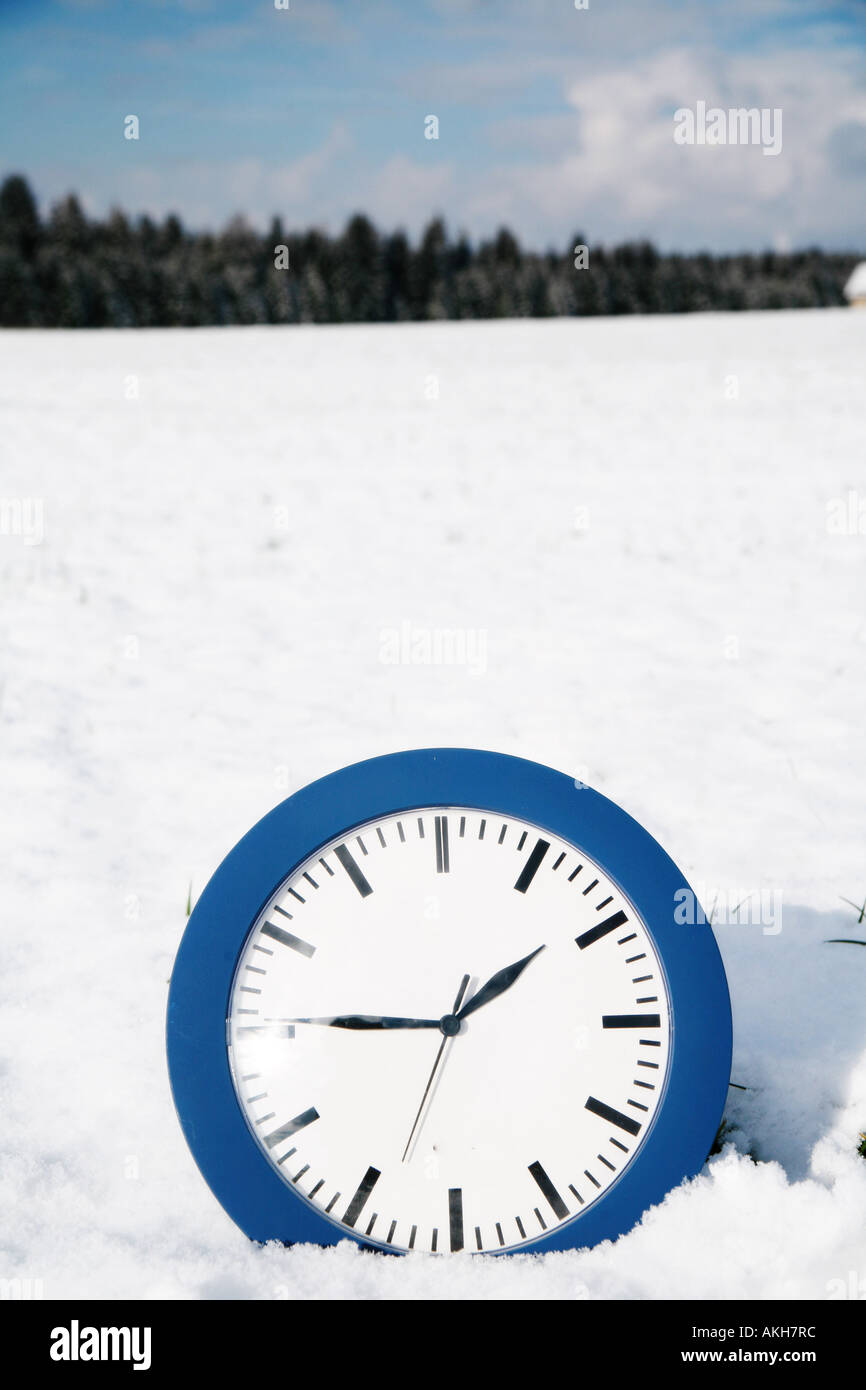 beautiful winter mood winter time clock in snow Stock Photo Alamy