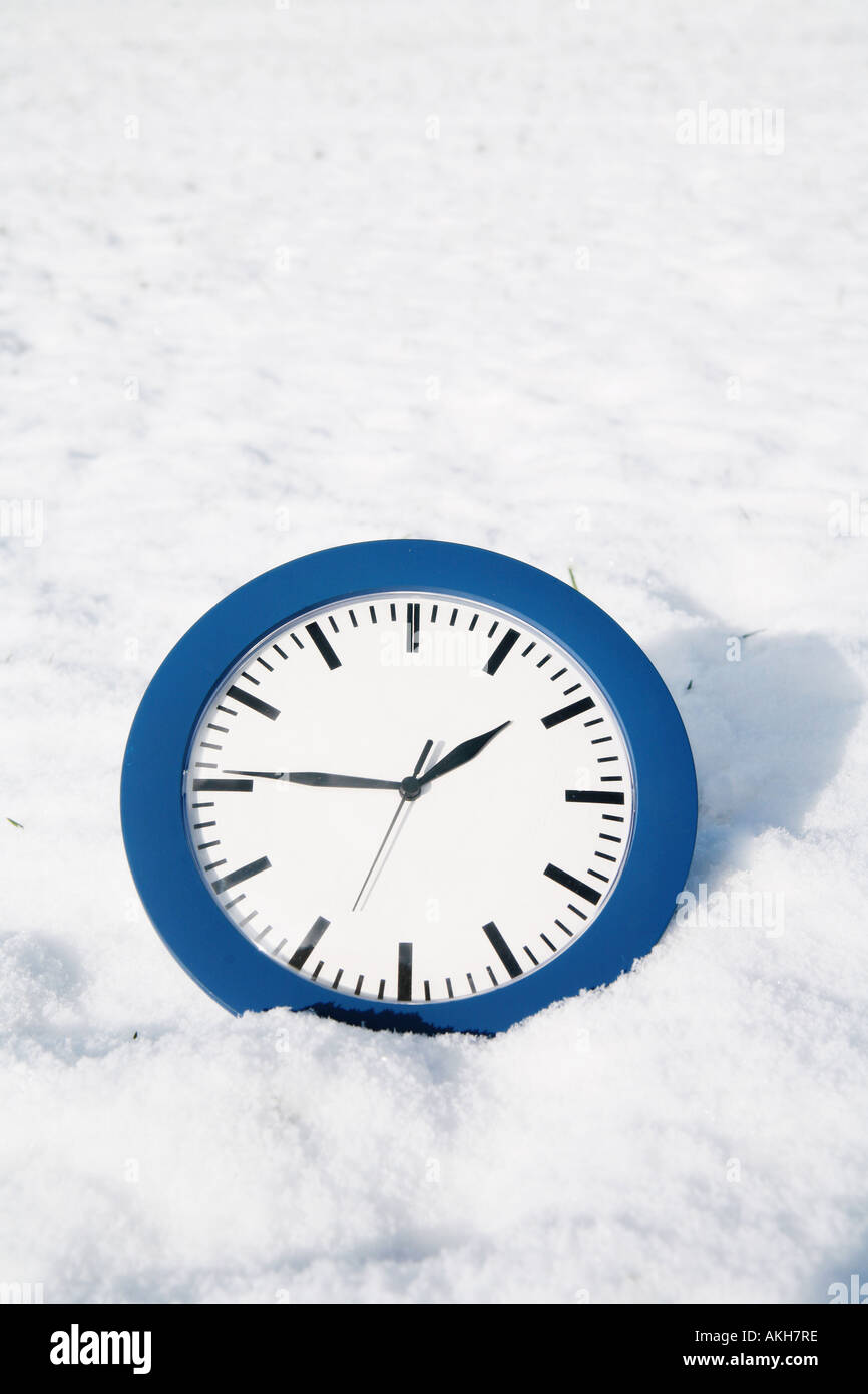 beautiful winter mood winter time clock in snow Stock Photo Alamy