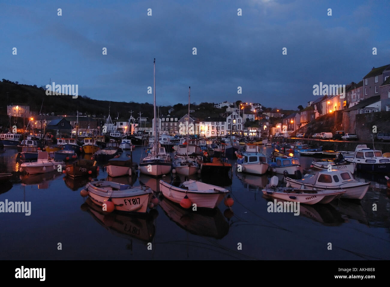 Night shot of an south west english coastal fishing village harbour with boats Mevagissey Cornwall United Kingdom Stock Photo