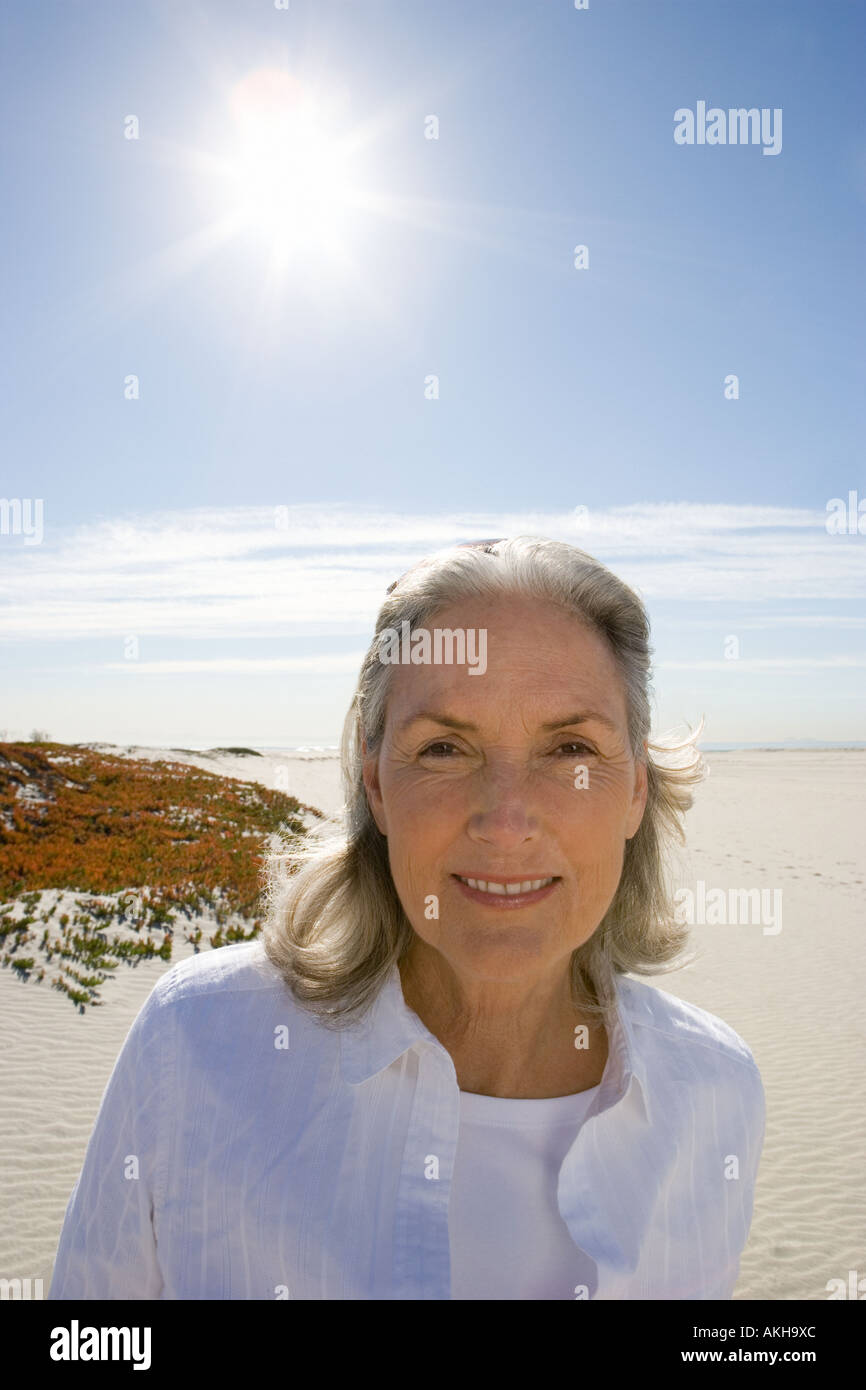 Senior woman on beach Stock Photo