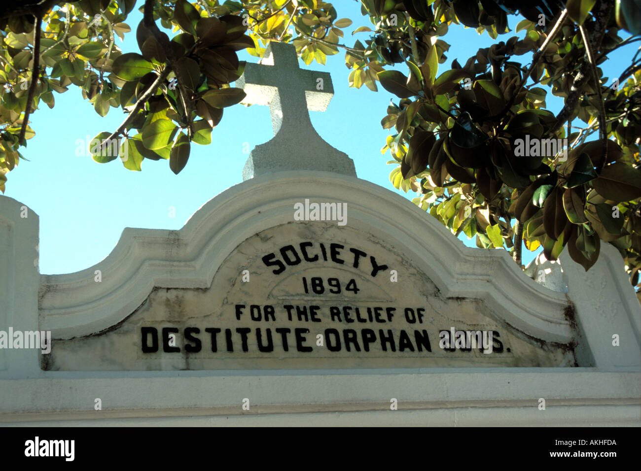 USA Louisiana New Orleans Orphans grave in New Orleans Cemetery cross tomb destitute boys Stock Photo