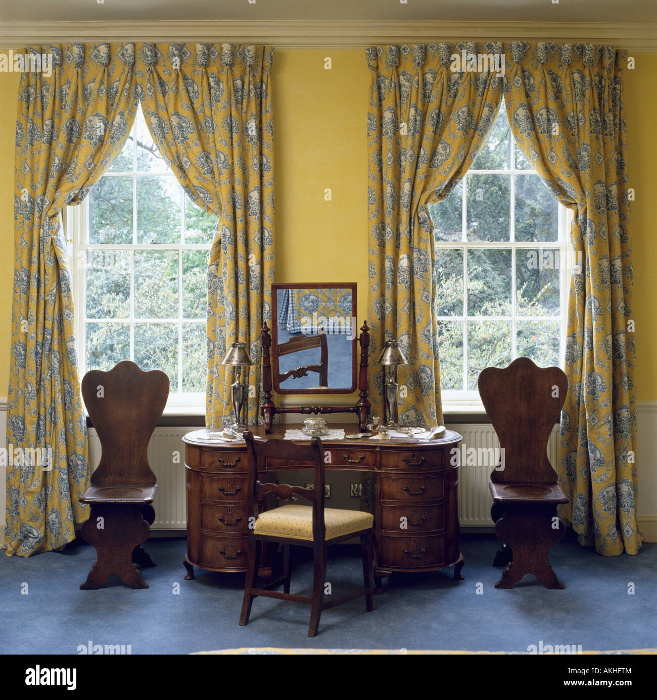 Blue And Yellow Patterned Curtains At Windows In Bedroom With
