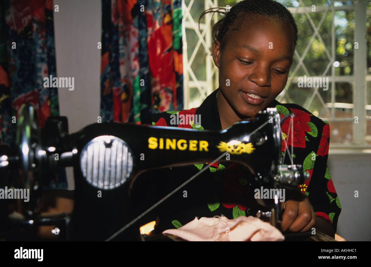 A young woman using a sewing machine, Harare, Zimbabwe Stock Photo Alamy