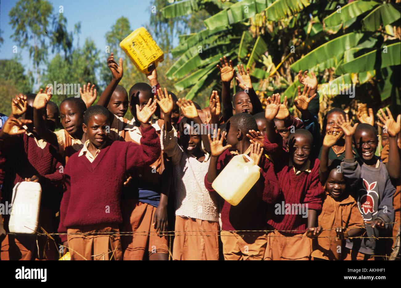 A group of school children waving, Shearley Cripps orphanage, Harare, Zimbabwe, Africa Stock Photo