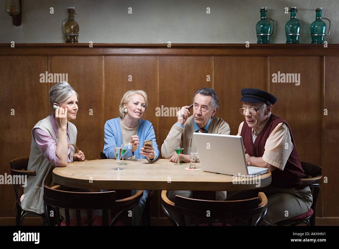 Senior adult with different technologies Stock Photo