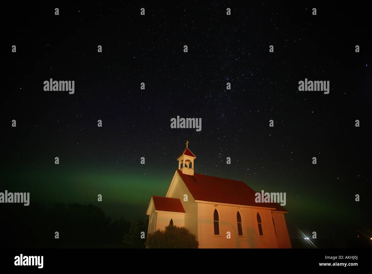 Northern Lights and star tracks over Saint Columba church Stock Photo