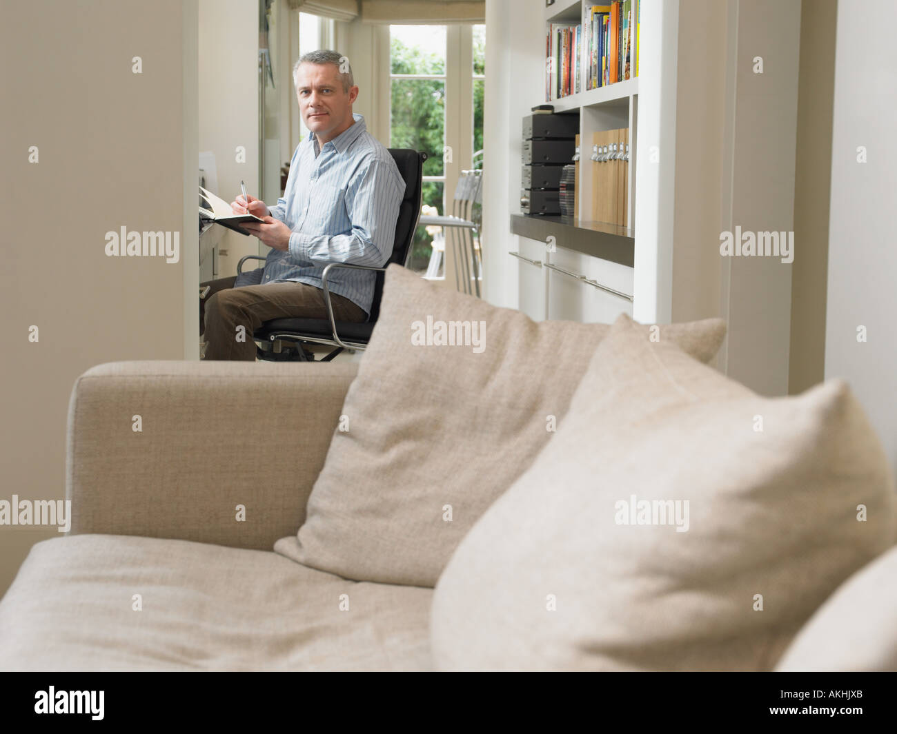 Man mature alone at home hi-res stock photography and images - Alamy