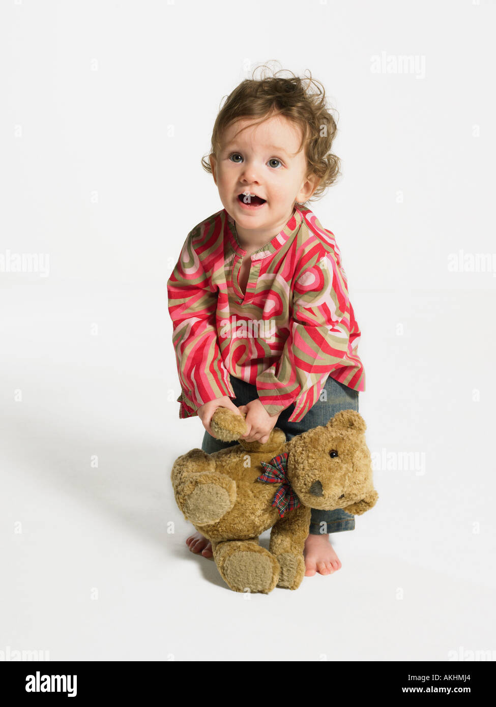 Toddler with a teddy bear Stock Photo - Alamy