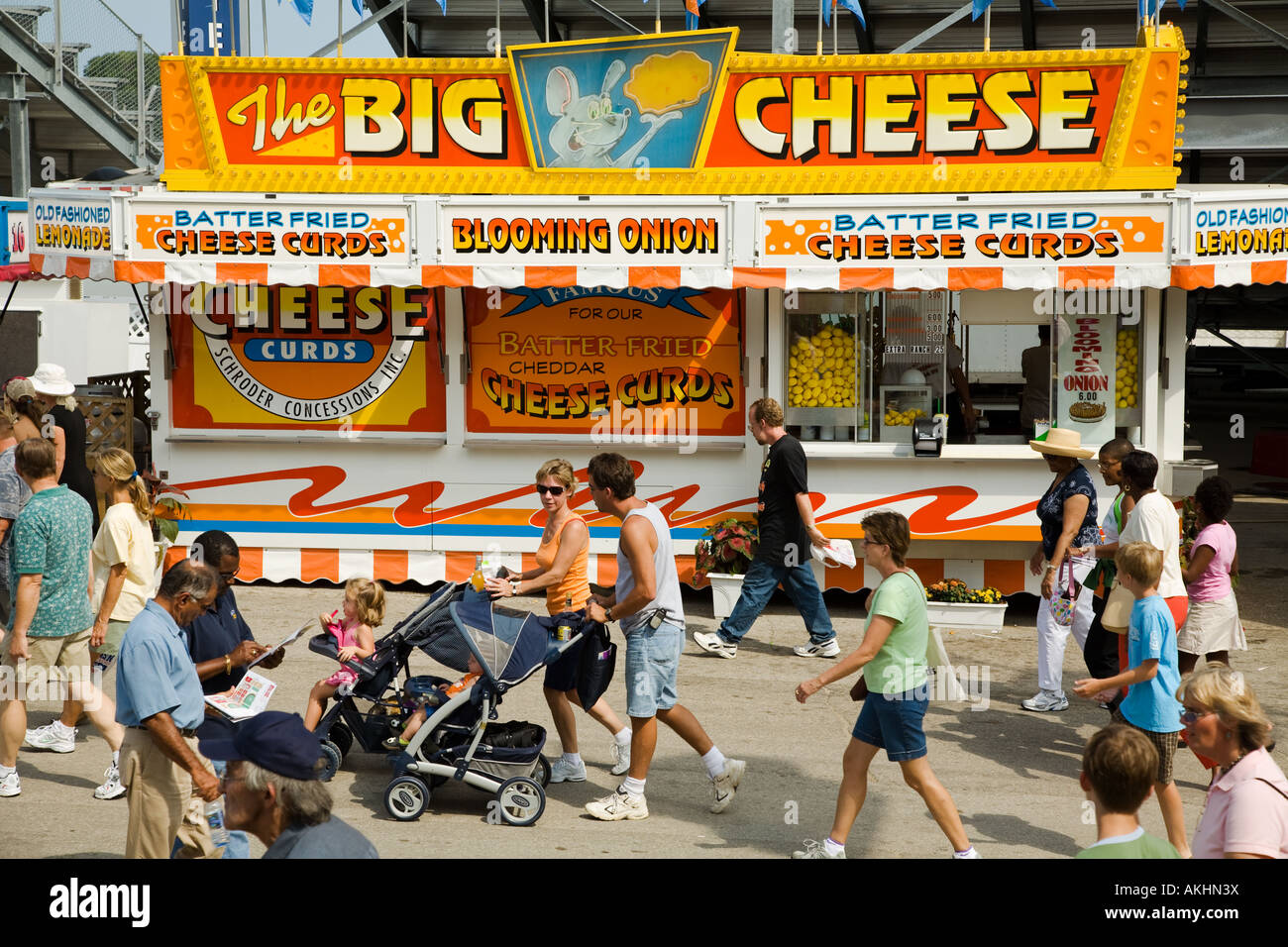 WISCONSIN Milwaukee People walk past a fast food booth selling cheese