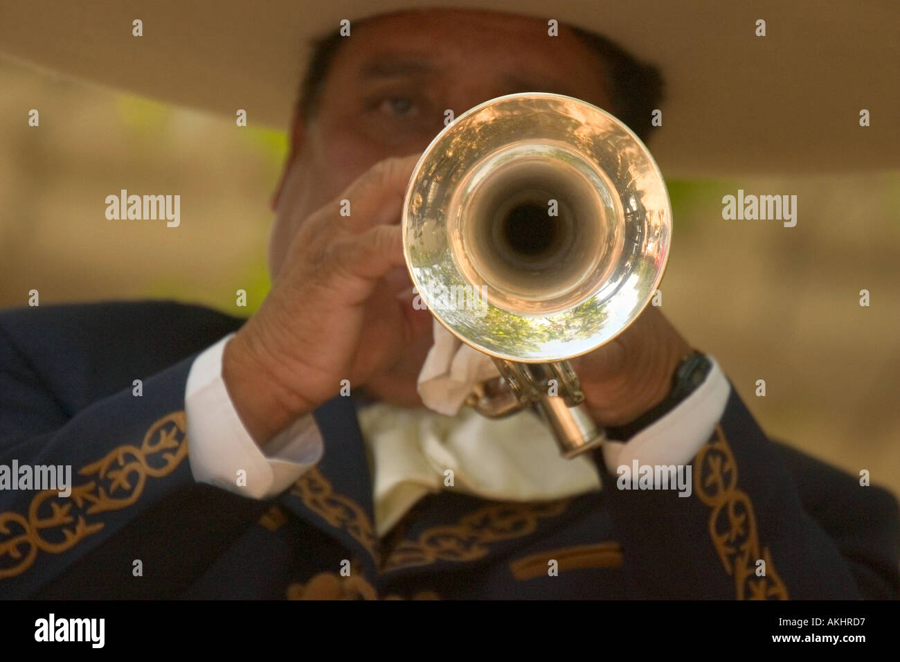 A close up image of an Hispanic man playing the trumpet Stock Photo