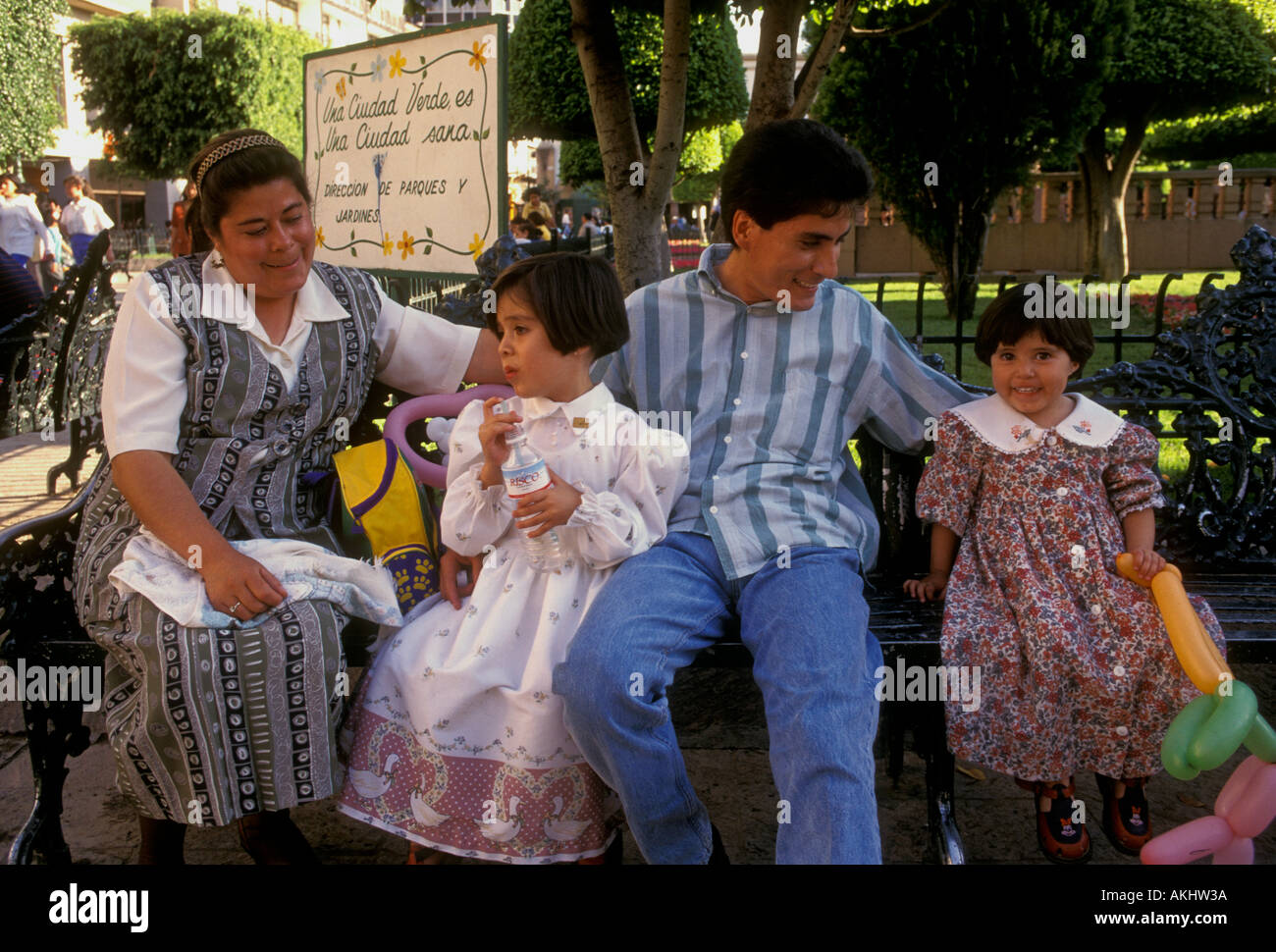 Mexican people, Mexican family, father mother and children, girls, Plaza Principal, main square, Leon, Guanajuato State, Mexico Stock Photo